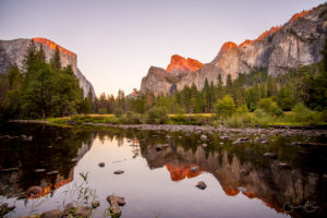 Yosemite sunset with rocks reflected in a lake